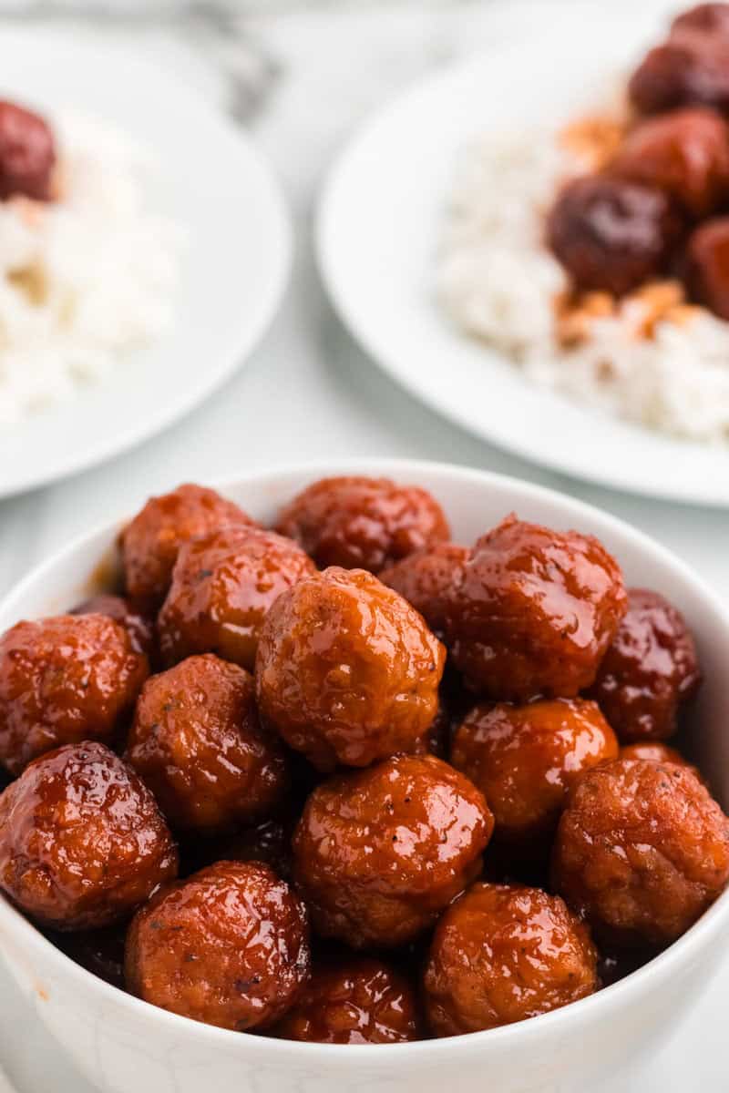 closeup of 3 Ingredient Meatballs served in a white bowl.