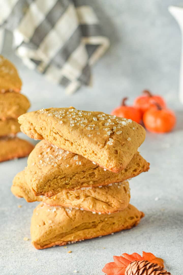 pumpkin scones stacked on top of each other.