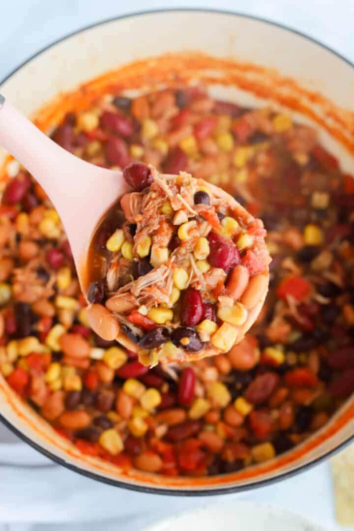 scooping the taco soup out of the pot.