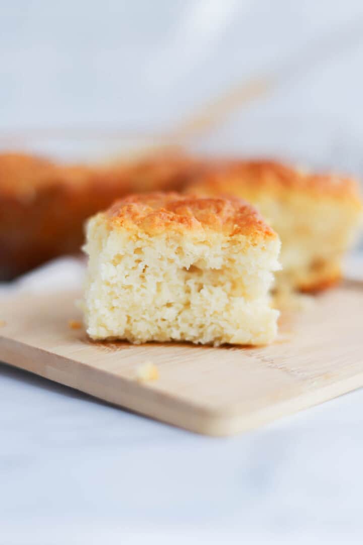 slice of biscuit on wooden serving board.