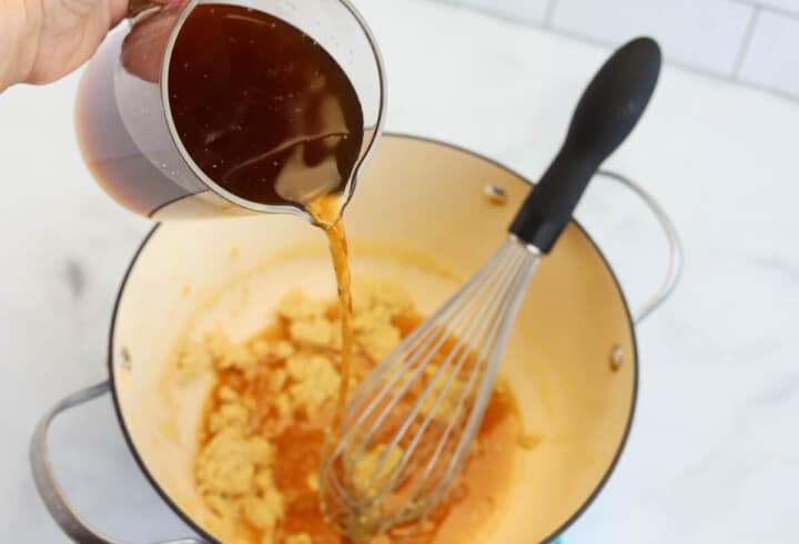 adding beef stock to the roux.