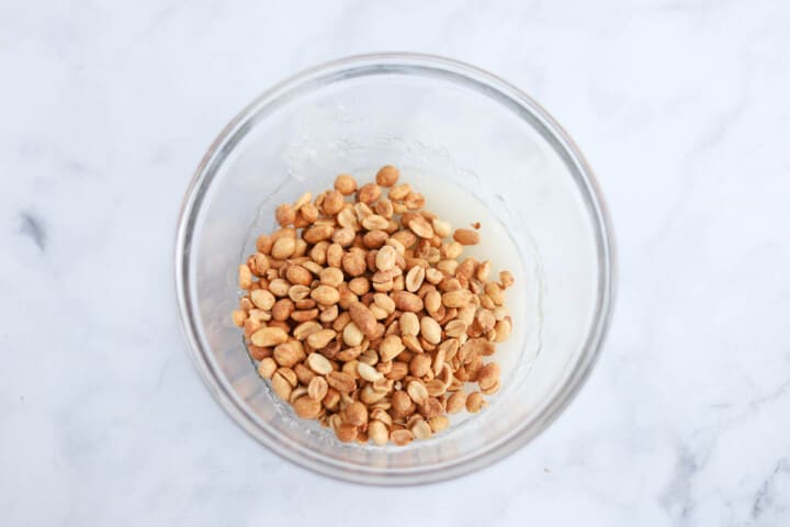 mixing ingredients in a clear bowl.