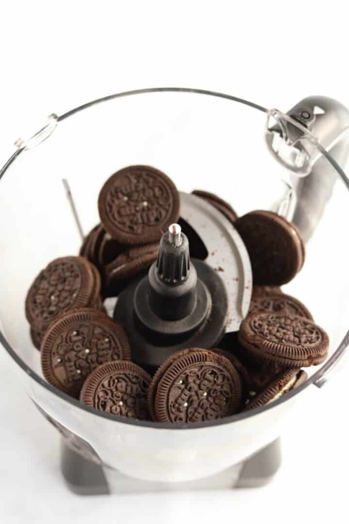 Oreos in food processor to be crushed.