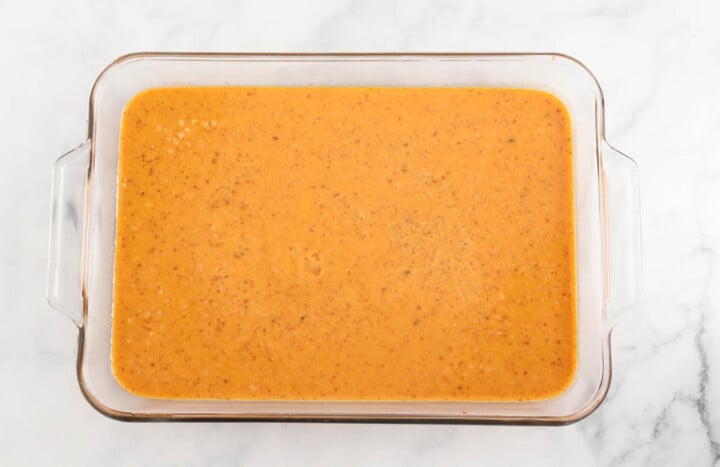 pumpkin puree mix on bottom of baking dish.