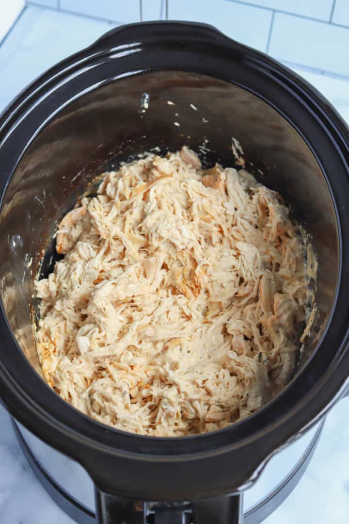 shredding the crack chicken in the crockpot.