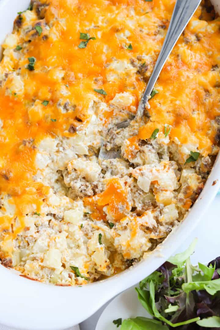 Hamburger Hashbrown casserole in white casserole dish.