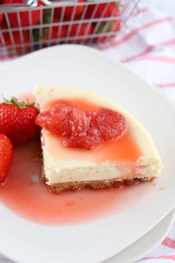 strawberry syrup on top of cheesecake.