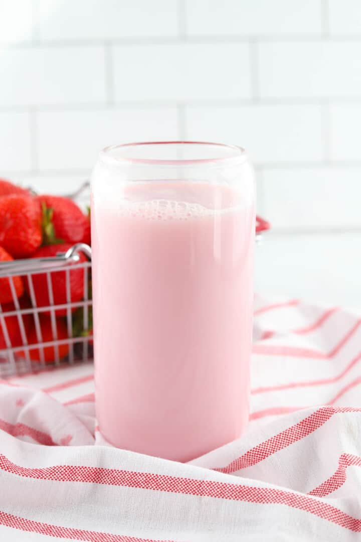 using the strawberry syrup to make strawberry milk.