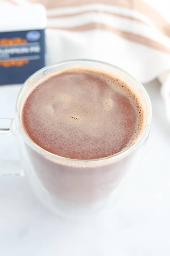 closeup of hot chocolate in clear mug.