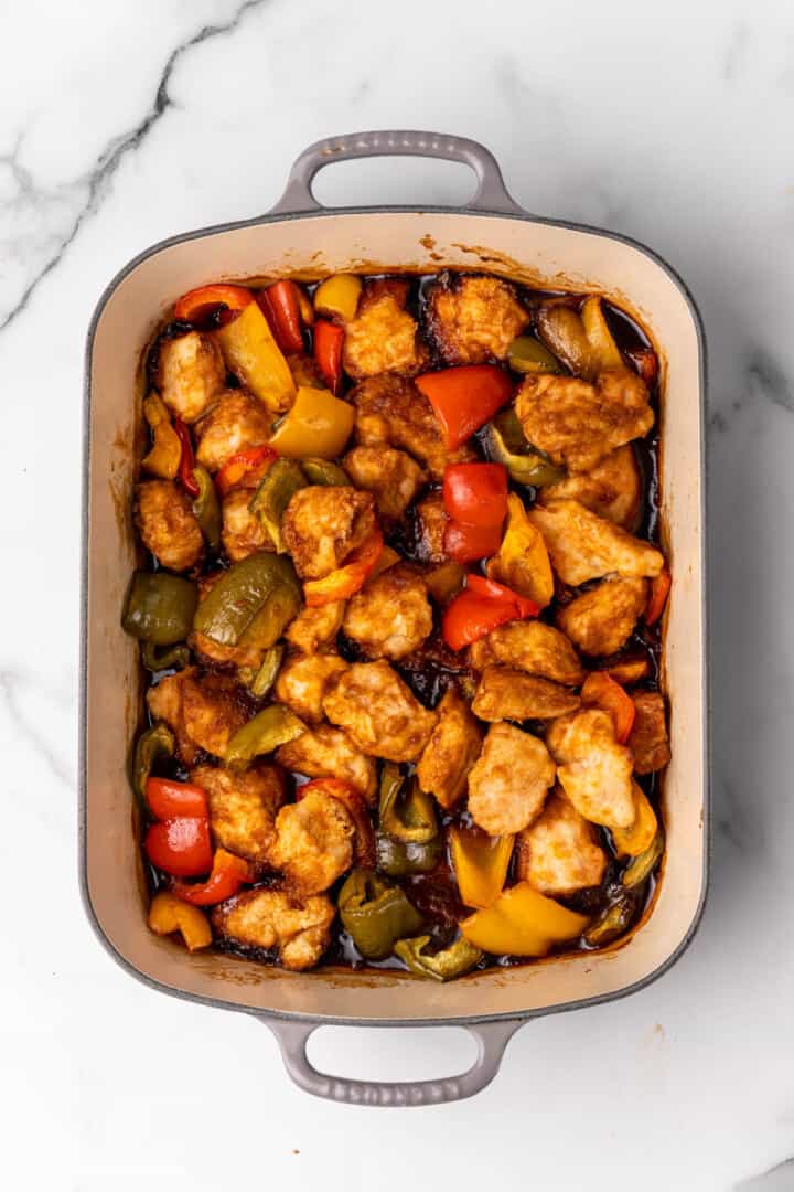 sweet and sour chicken baked in casserole dish.
