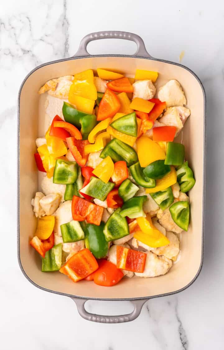 chicken and veggies in casserole dish.