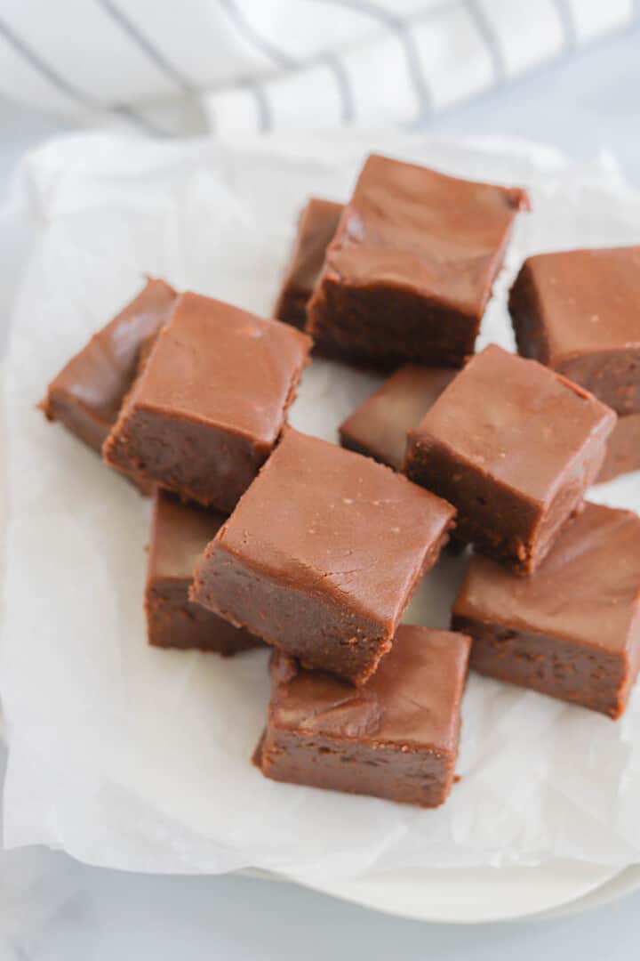 2 Ingredient Fudge Squares on parchment paper.