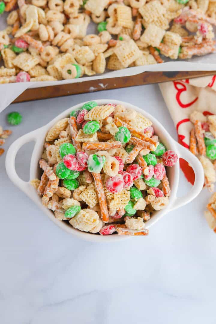 closeup of Chex mix in white serving bowl.