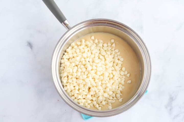 melting the white chocolate chips with the evaporated milk.