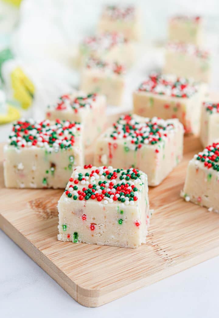 closeup of Christmas Fudge on wooden serving board.