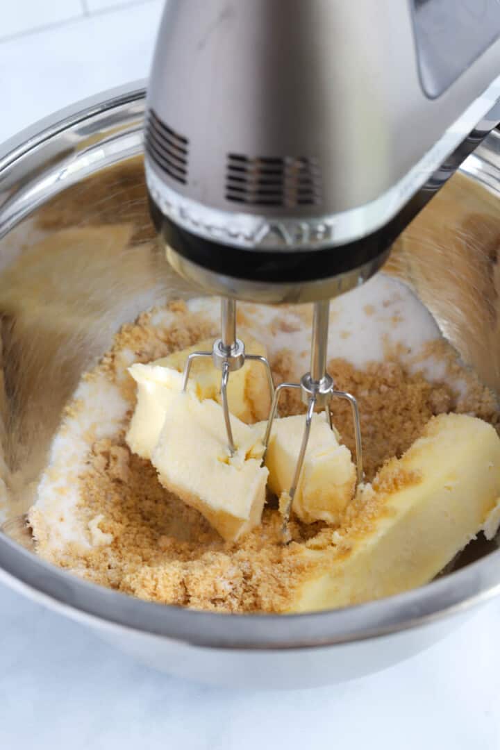 mixing together the butter and sugars.