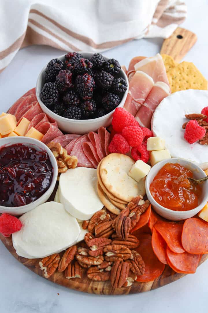 Easy Charcuterie Board loaded with meats, cheeses, and fruits.