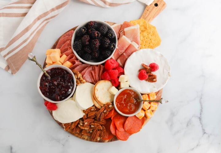 adding fruit to the board.