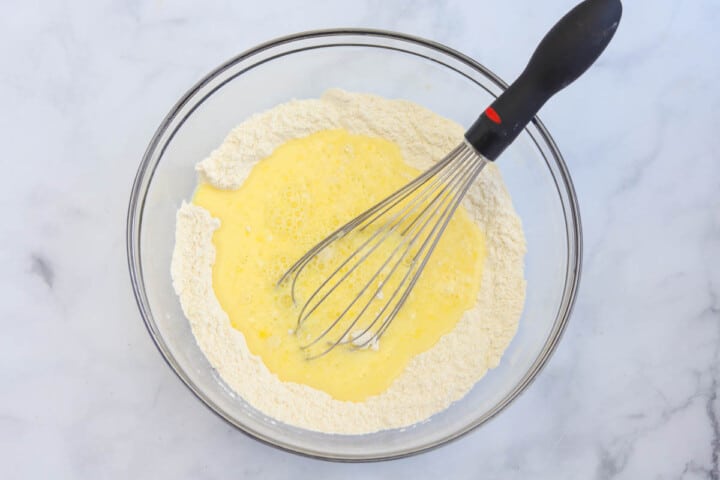 mixing together the batter for the pancakes.