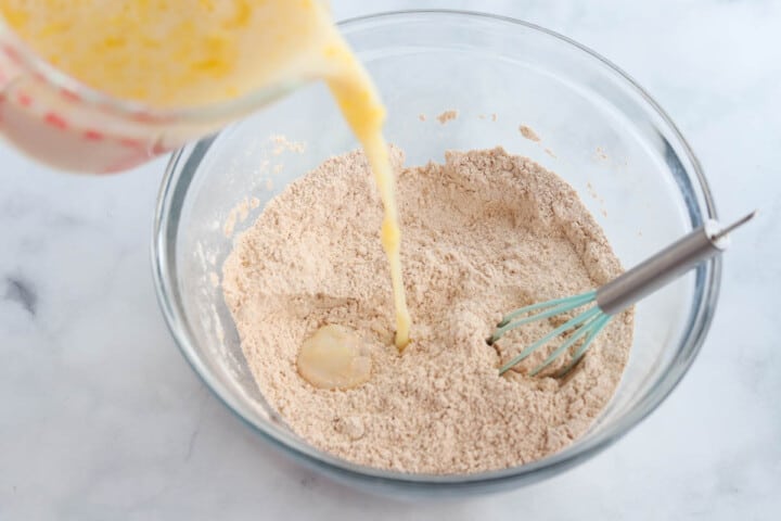 adding the wet ingredients to the pancake batter.