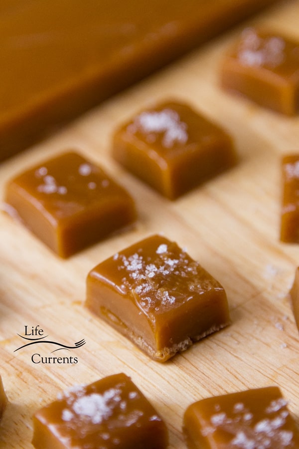 old fashioned cream caramels on wooden serving board.