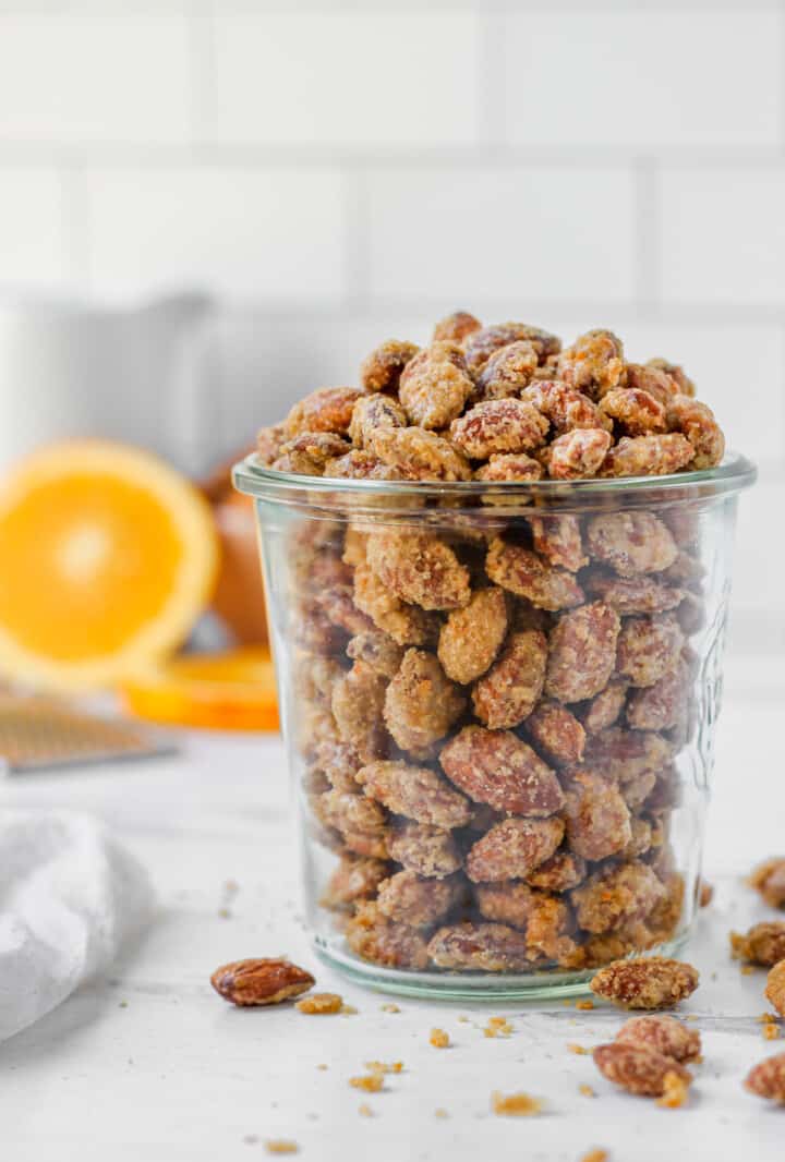  Orange Candied Almonds in glass jar for serving.
