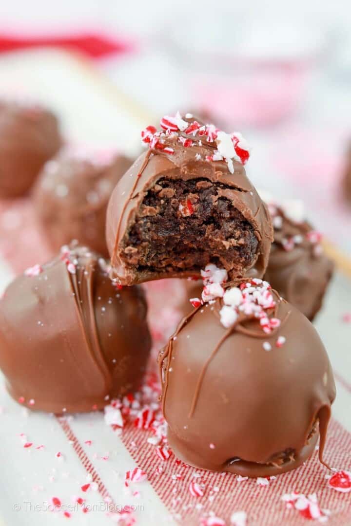 Peppermint Brownie Truffles stacked on serving tray.