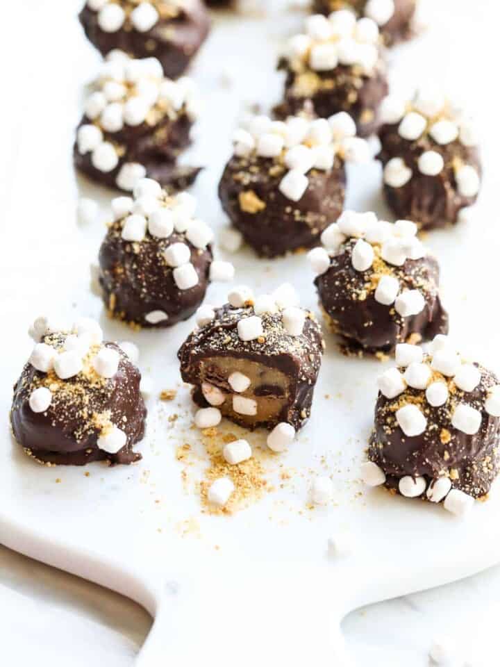 S'more Cookie Dough Truffles on white serving board.