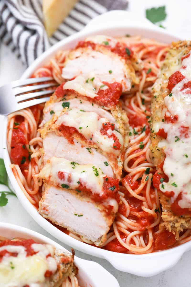 chicken parmesan sliced in white bowl.