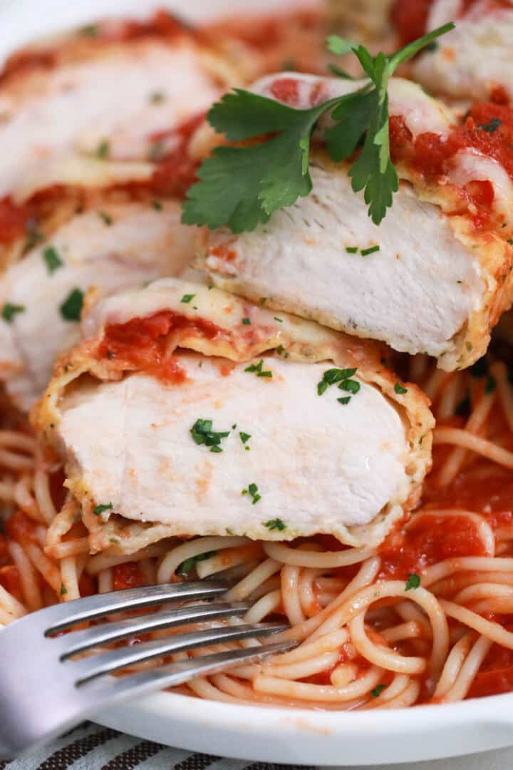 closed up for chicken parmesan baked on top of spaghetti.