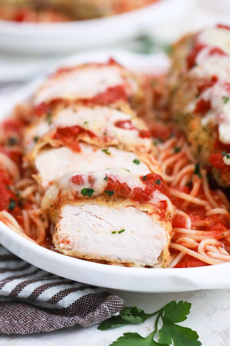 closeup of sliced chicken parmesan.