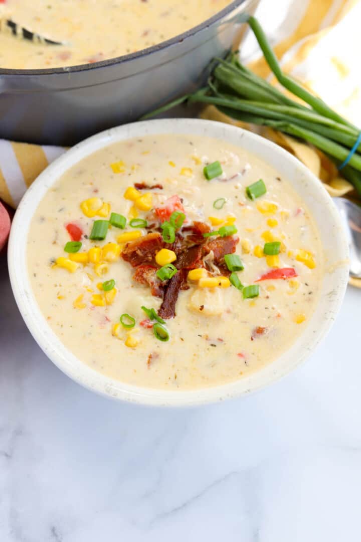 closeup of the chicken corn chowder in white bowl.
