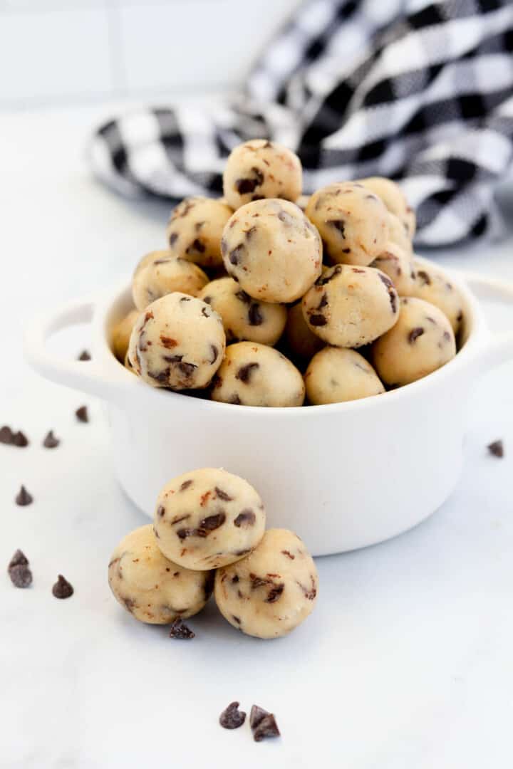 closeup of cookie dough balls in white bowl.