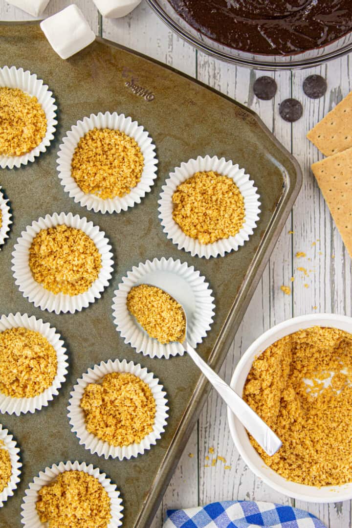 adding crust to the muffin liners.