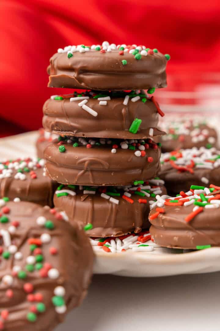 four chocolate covered Oreos stacked on top of each other.