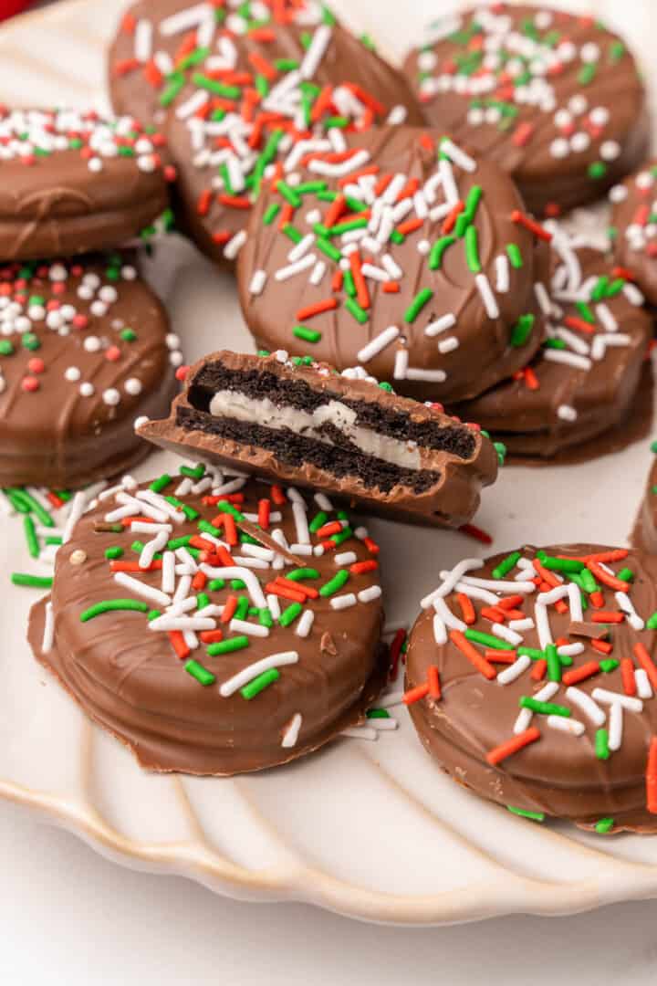 Chocolate Covered Oreos with bite taken out of one.