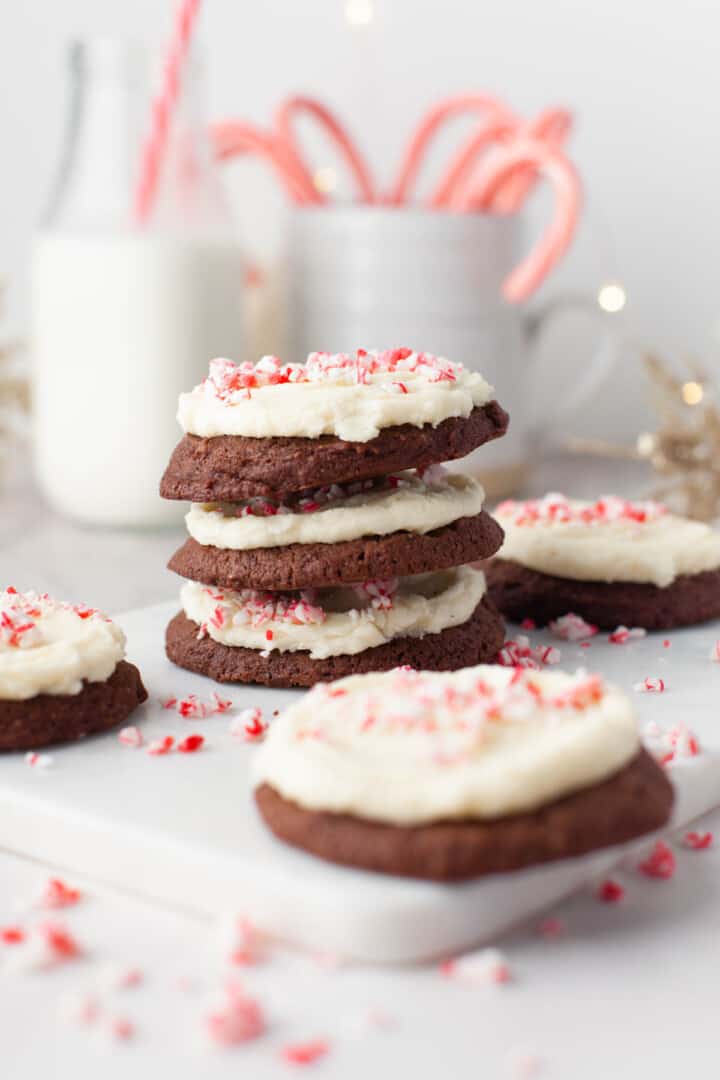 cookies stacked on each other on white serving tray.