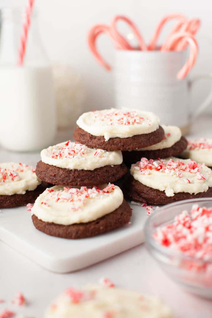 closeup of Chocolate Peppermint Cookies stacked on white tray.