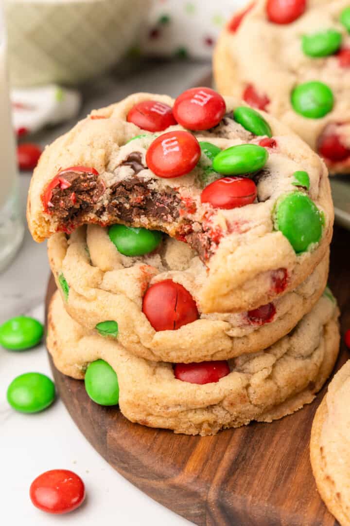 closeup of cookies stacked on top of each other with bite taken out of one.