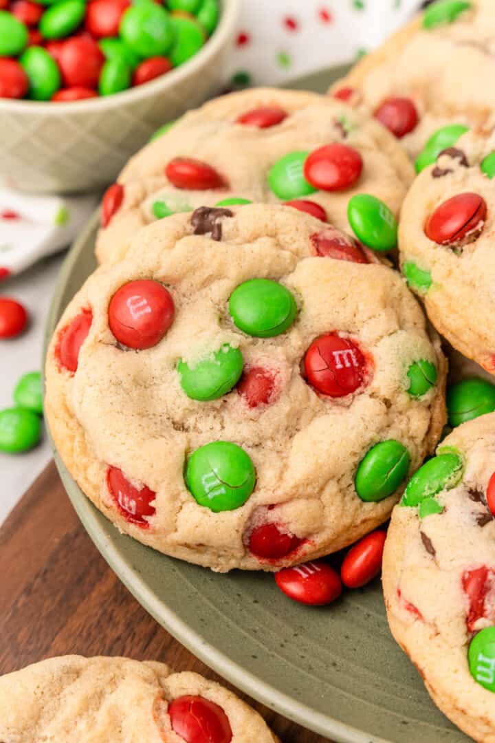 Christmas M&M Cookies on green serving plate.