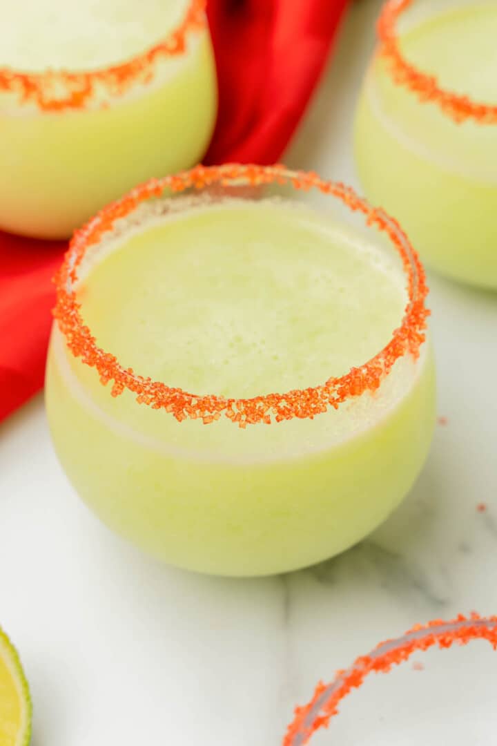 Grinch Punch in glass with sugared rim.