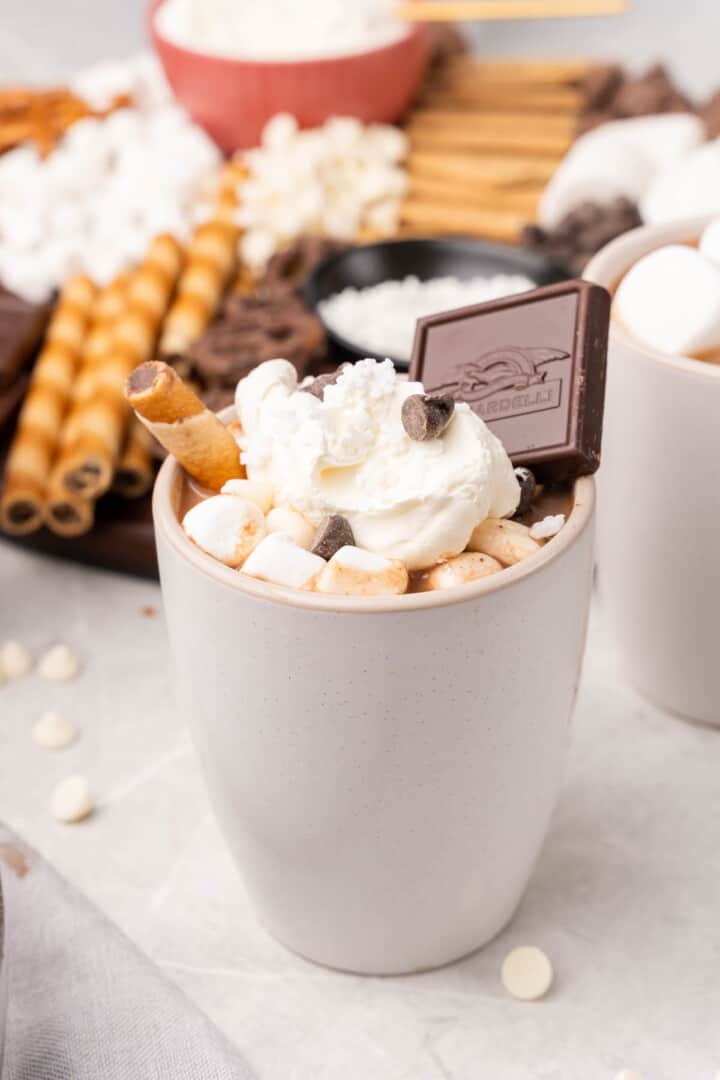 a mug of chocolate with different toppings on it.