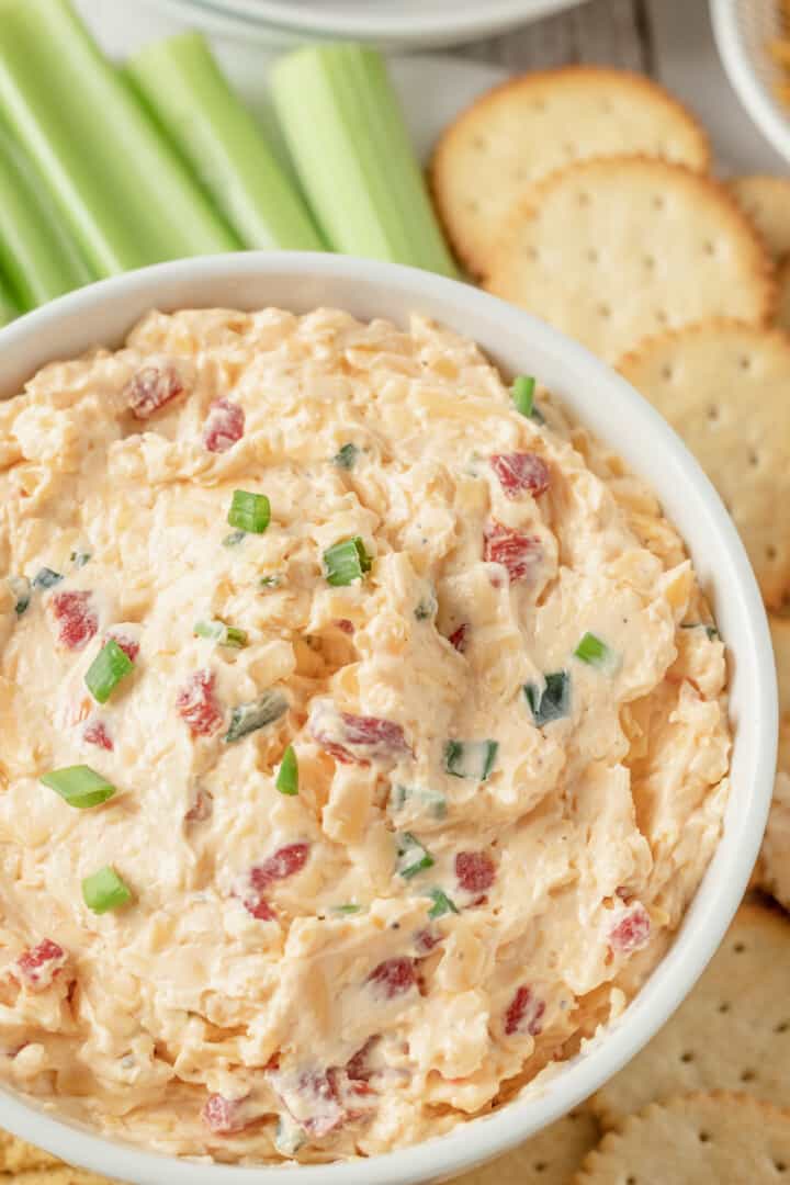 closeup of the pimento cheese dip in white bowl.