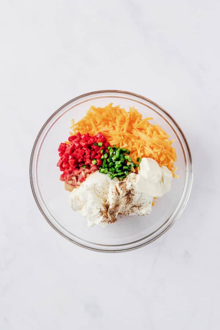 all ingredients for the dip in a glass bowl.