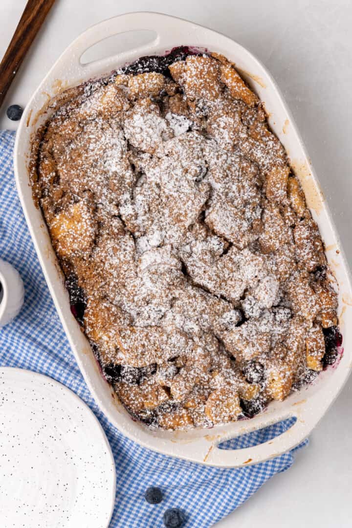 baked casserole topped with powdered sugar.
