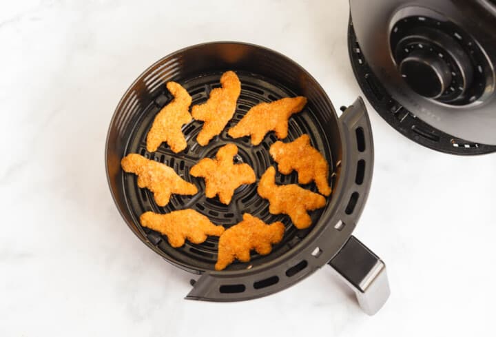 Dino Nuggets in the air fryer basket.