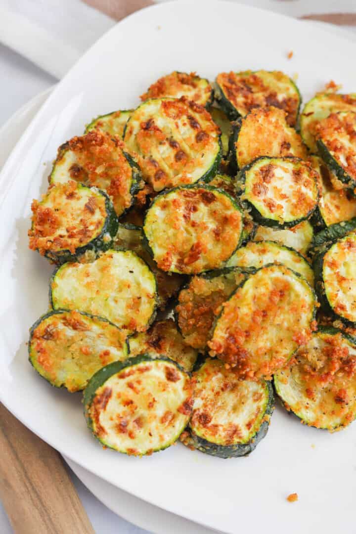 Air Fryer Zucchini on white plate for serving.