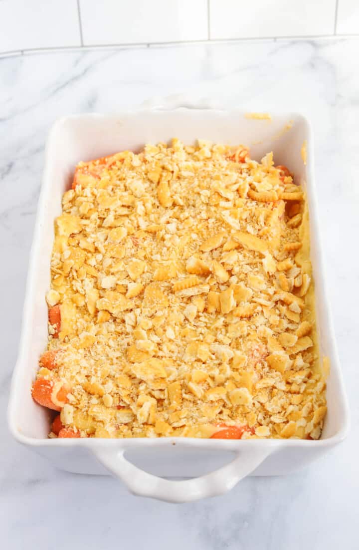 adding crushed Ritz crackers to the top of the casserole.