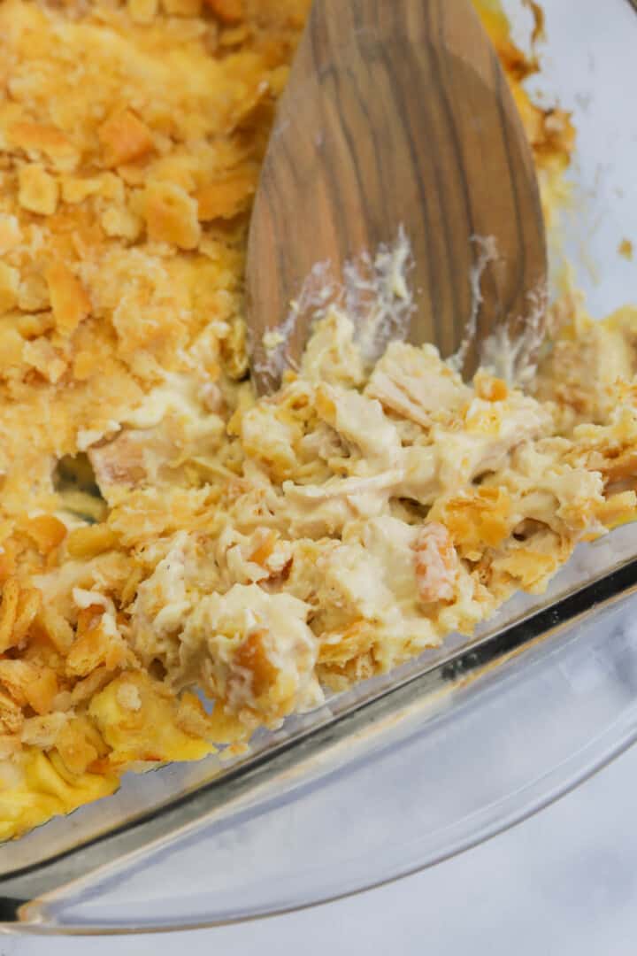 Rotisserie Chicken Casserole being served with wooden spoon.