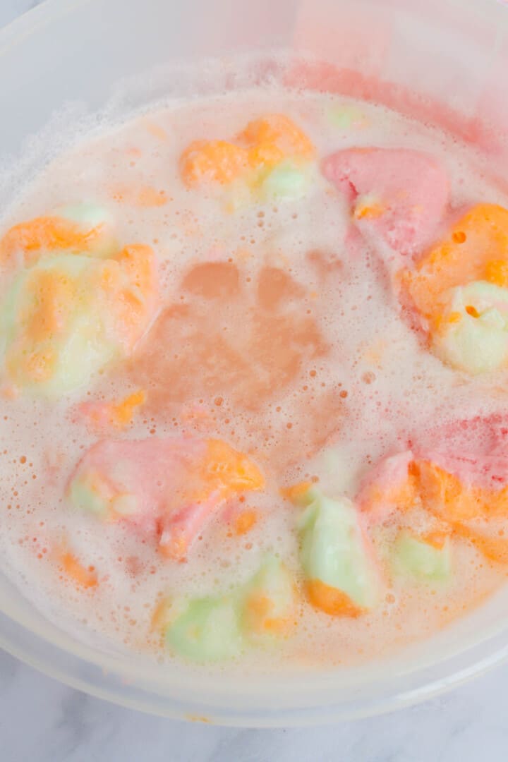 soda and sherbet mixed together in large punch bowl.